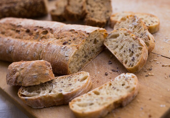 fresh loaf of bread on wooden board