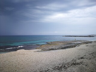 Fototapeta na wymiar Seaside beach with blue skies and fishermen nets