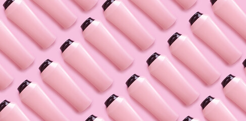 Obraz premium bottle of shampoo and balm on a colored pink background
