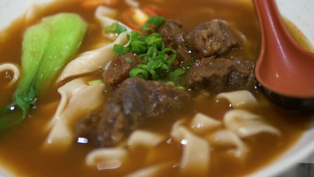 Taiwanese tomoto beef noodle soup with thick noodle
