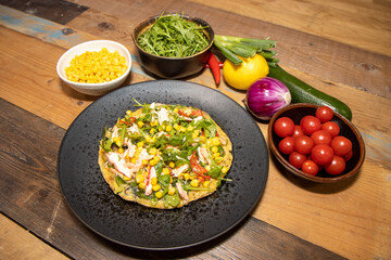 A plate of delicious salmon and sweetcorn frittata, served with a spring onion dressing.