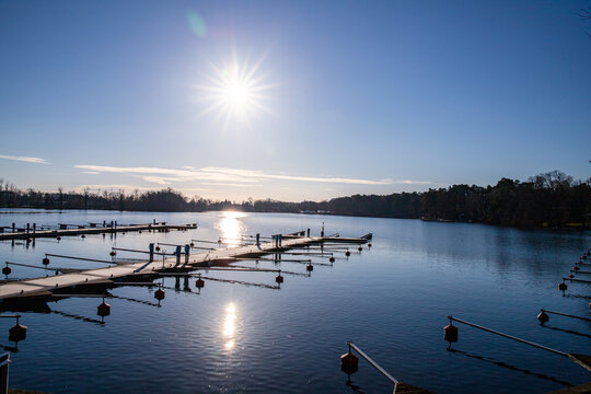 Empty docks in the port of Scharmuetzelsee, Brandenburg, Germany. Empty docks in winter under the clear sky at noon.