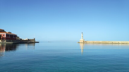 Fototapeta na wymiar Chania Venetian Harbor, the lighthouse and Firka fortress 