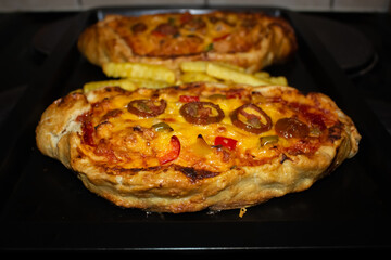 Cheesy Turkish pide pizzas on a tray