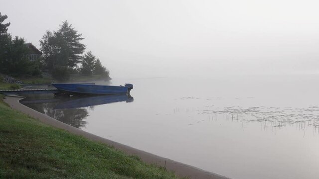 14 foot Aluminum Boat Docked on Misty Mysterious Morning - Foggy Lake Ontario Canada