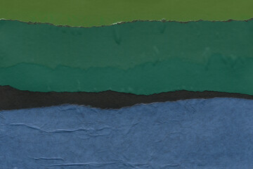 Colorful torn paper collage close-up. Texture made from various paper and cardboard parts. Damaged old paper background. Vintage blank wallpaper. Material design backdrop.