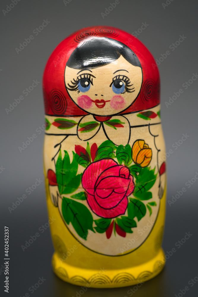 Wall mural the biggest matrioshka doll isolated on dark background