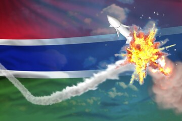 Naklejka na ściany i meble Gambia intercepted nuclear warhead, modern antirocket destroys enemy missile concept, military industrial 3D illustration with flag
