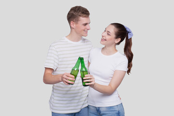 Couple Holding Beer Bottle Looking at Each OtherIsolated. Couple Standing and Holding Beer Bottles. Man and Woman Hugging, Lovers, Friends, Couple Concept.