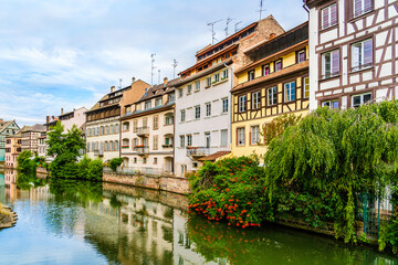 Fototapeta na wymiar Colorful half timbered houses on the banks of River Ill in Strasbourg, Alsace region, France
