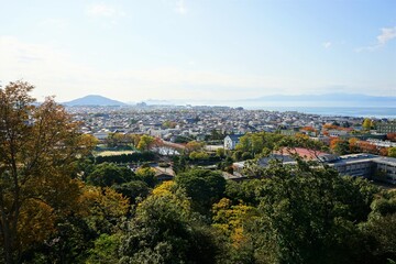 View of bright autumn leaves and city landscape from  Hikone Castle Park Shiga, Japan - 日本 滋賀 彦根城 西の丸からの眺望