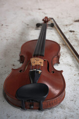 Fototapeta na wymiar Front side of violin put on grunge surface background,