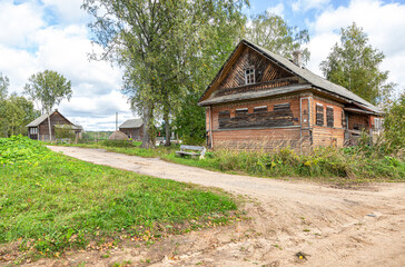 Fototapeta na wymiar Abandoned old rural wooden house in russian village