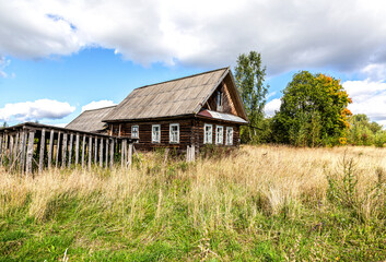 Fototapeta na wymiar Abandoned old rural wooden house in russian village