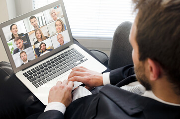 Fototapeta na wymiar Video conference with multiple employees