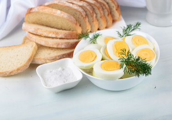 Fototapeta premium Boiled eggs with bread and salt.