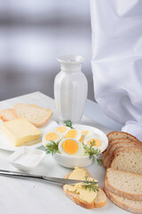 Boiled eggs with bread and salt.
