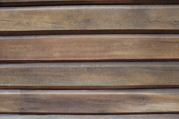 The texture of the wall of a treated wood building.