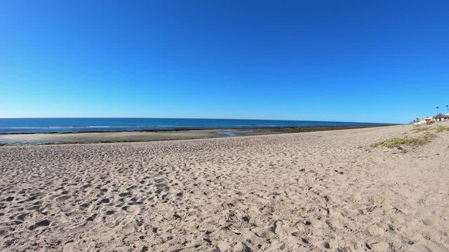 Time-lapse of the sandy beach and ocean waves at Las Chochas, Puerto Pe&ntilde;asco, Gulf of California, Mexico.