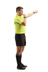 Side view of a football referee blowing a whistle