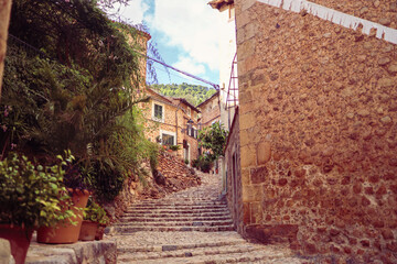 Fototapeta na wymiar Stairs and fincas in an old Spanish mountain village Fornalutx, Mallorca, Spain