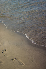 Traces on sand on the greece beach near to sea