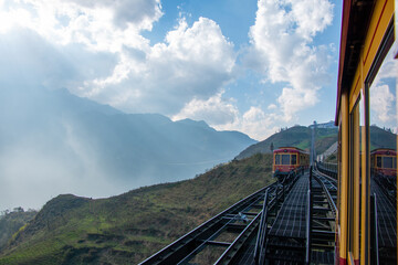 Sun rays shining on the mountains and the train at Sapa in northern Vietnam