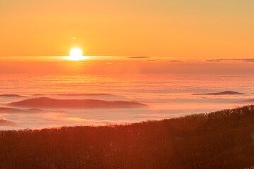 Founder’s Vision – Sunrise over sea of low-lying clouds with islands of Blue Ridge Mountains