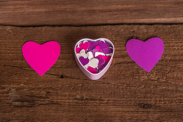 Heart-shaped box with paper hearts inside
