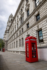 Fototapeta na wymiar Traditional red telephone booth in London. Great Britain