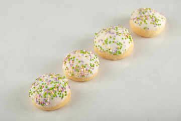 Set of sweet doughnuts with colorful sprinkles