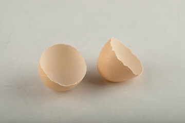 Broken brown eggshell on a marble background
