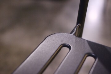 Close up of line pattern steel chair