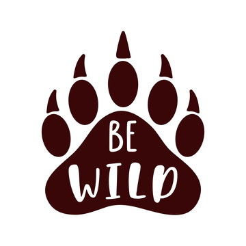 Be wild. Hand drawn inspiration quote with bear paw silhouette. 