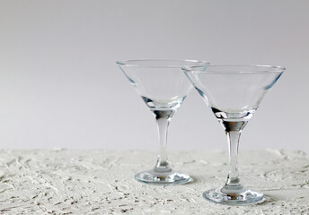 two empty martini glasses of cocktail on white background. alcohol drinks. Glasses for cocktail on the table. copy space