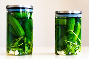 glass jar with pickled cucumbers