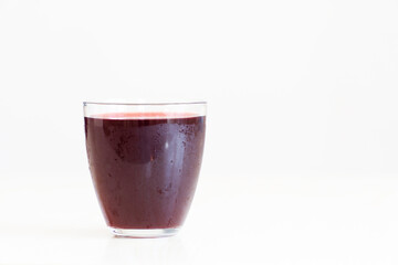 A glass of red juice
