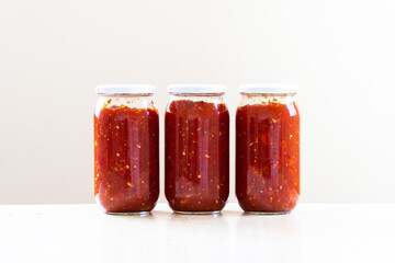 Glass jar with tomato sauce