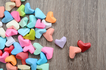 Origami hearts on wooden decoration