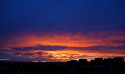 cloudy sky with multicolor lights during sunset