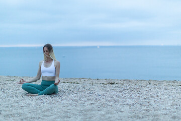 Fototapeta na wymiar Meditation on Beach Blonde Female