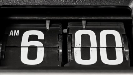 Retro flip clock changing from 5:59am to 6:00am on a Monday morning