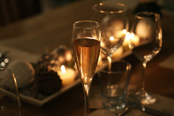 Wine and champagne glasses on festive Christmas dinner table 
