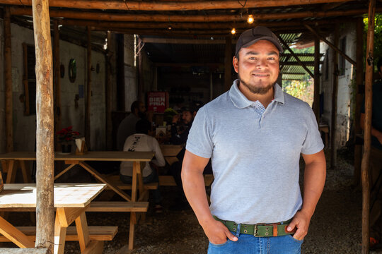 portrait of a young man in a typical mexican food place