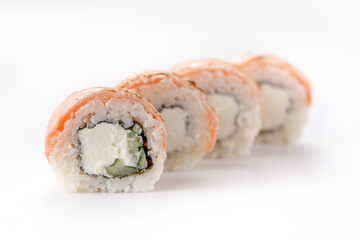 Baked Philadelphia sushi rolls on a white background. Isolated. Restaurant concept. Close-up.