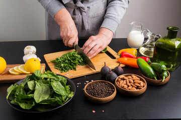 spinach and spices on the cook's table