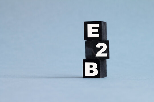 B2E. The text is on the dark and light cubes. Bright solution for business, financial, marketing concept