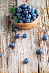 blueberries in  wooden plate