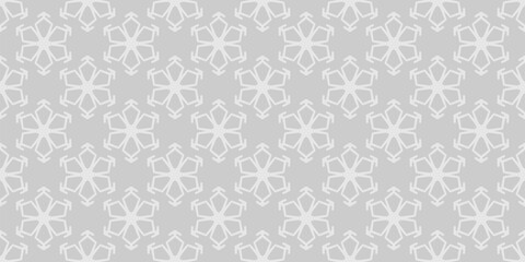 Simple white ornament on a gray background in Asian style. Seamless wallpaper texture