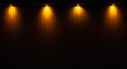 empty wooden table on which beams of light from lamps fall on a dark background, place for your...
